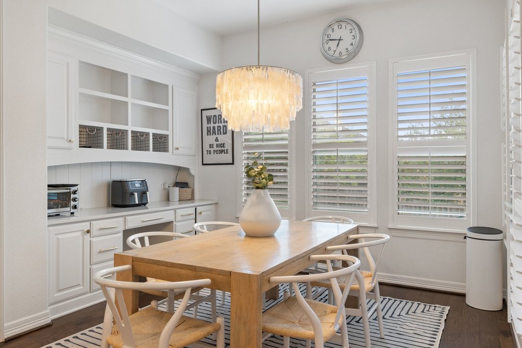 8801 Wild Rice Cove Austin, TX 78738 - Photo 15 of 40 The spacious dining area overlooks the backyard and features a convenient built-in desk area.