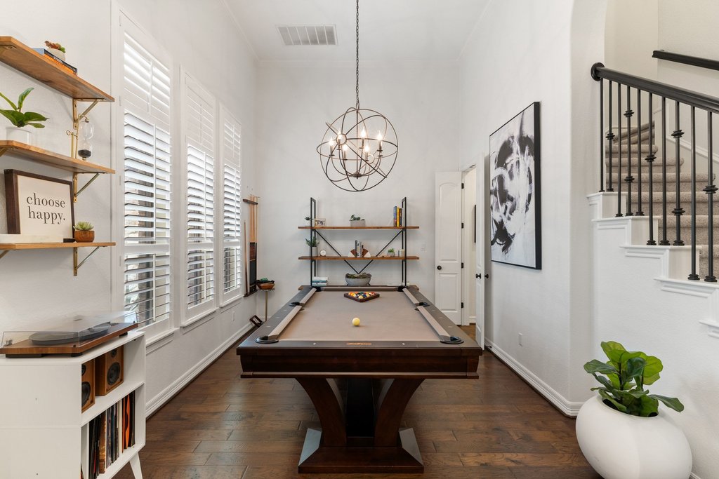 8801 Wild Rice Cove Austin, TX 78738 - Photo 17 of 40 Elegant flexible use formal dining opens off the foyer and features a gorgeous modern chandelier.