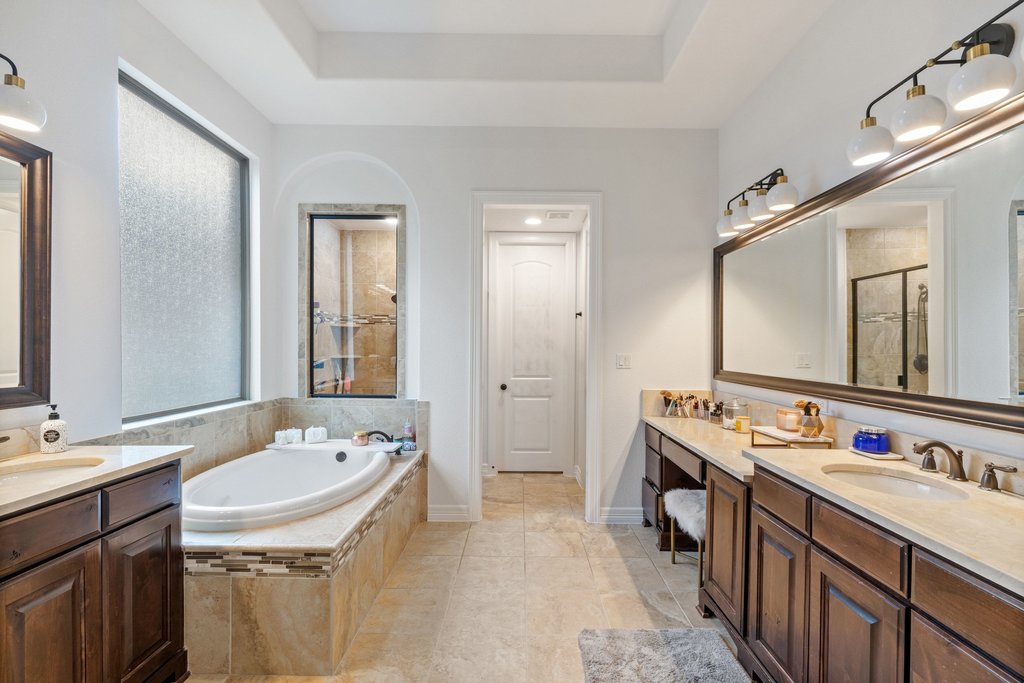 8801 Wild Rice Cove Austin, TX 78738 - Photo 20 of 40 The luxury ensuite bath serves as your daily spa getaway.