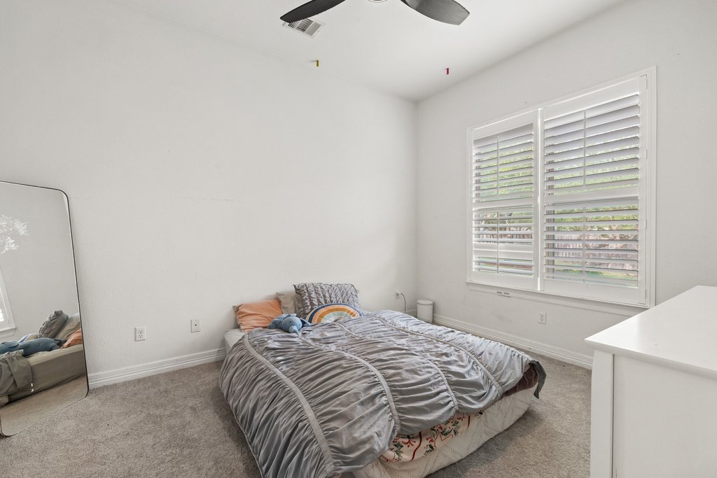 8801 Wild Rice Cove Austin, TX 78738 - Photo 25 of 40 There's also a convenient main floor guest bedroom.