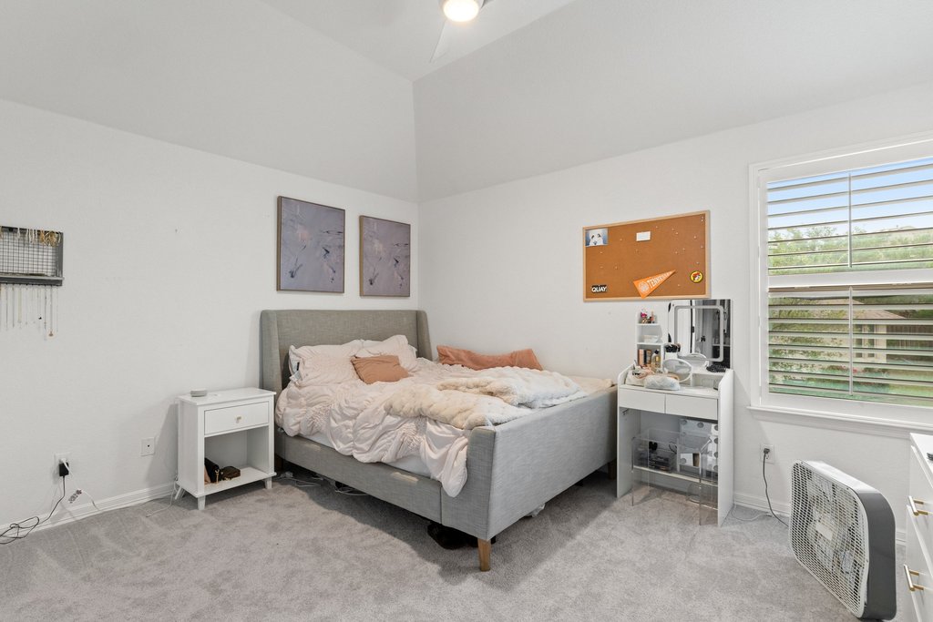 8801 Wild Rice Cove Austin, TX 78738 - Photo 29 of 40 Upstairs you will find three well sized secondary bedrooms.