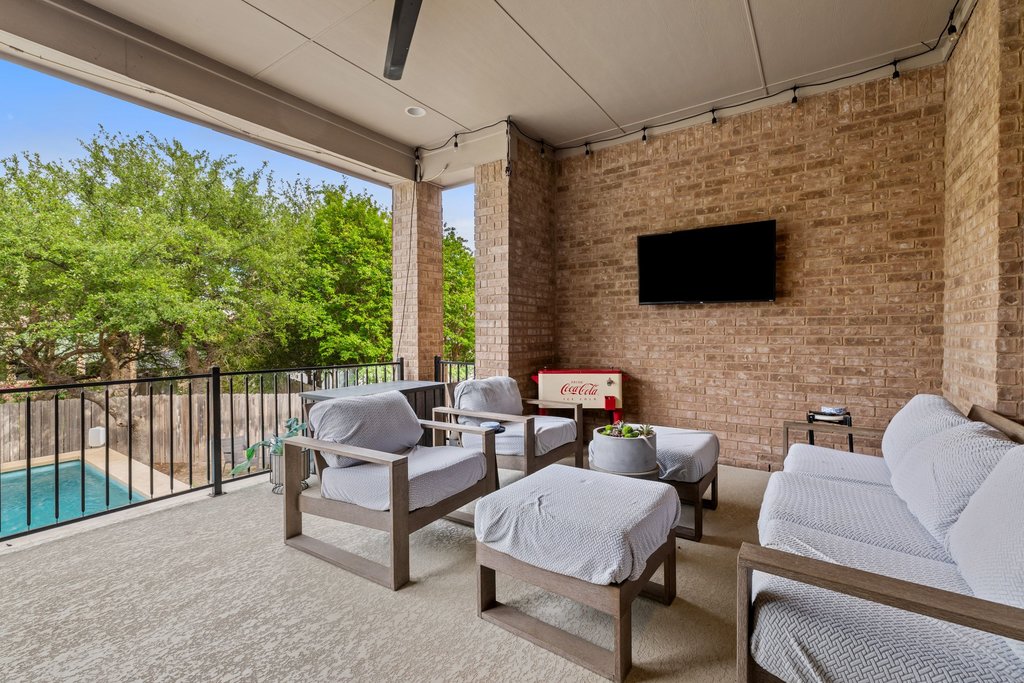 8801 Wild Rice Cove Austin, TX 78738 - Photo 35 of 40 Your living area extends outdoors onto the spacious entertainer's covered porch.