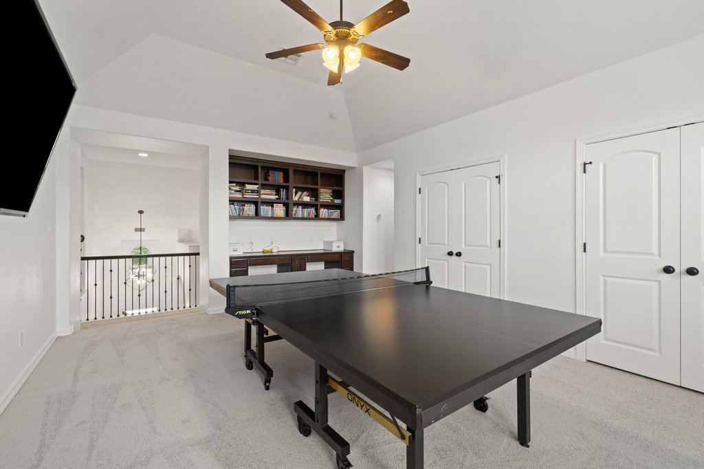 8801 Wild Rice Cove Austin, TX 78738 - Photo 4 of 40 The interior spans almost 4500 sq ft with multiple living areas including second floor game and media rooms.