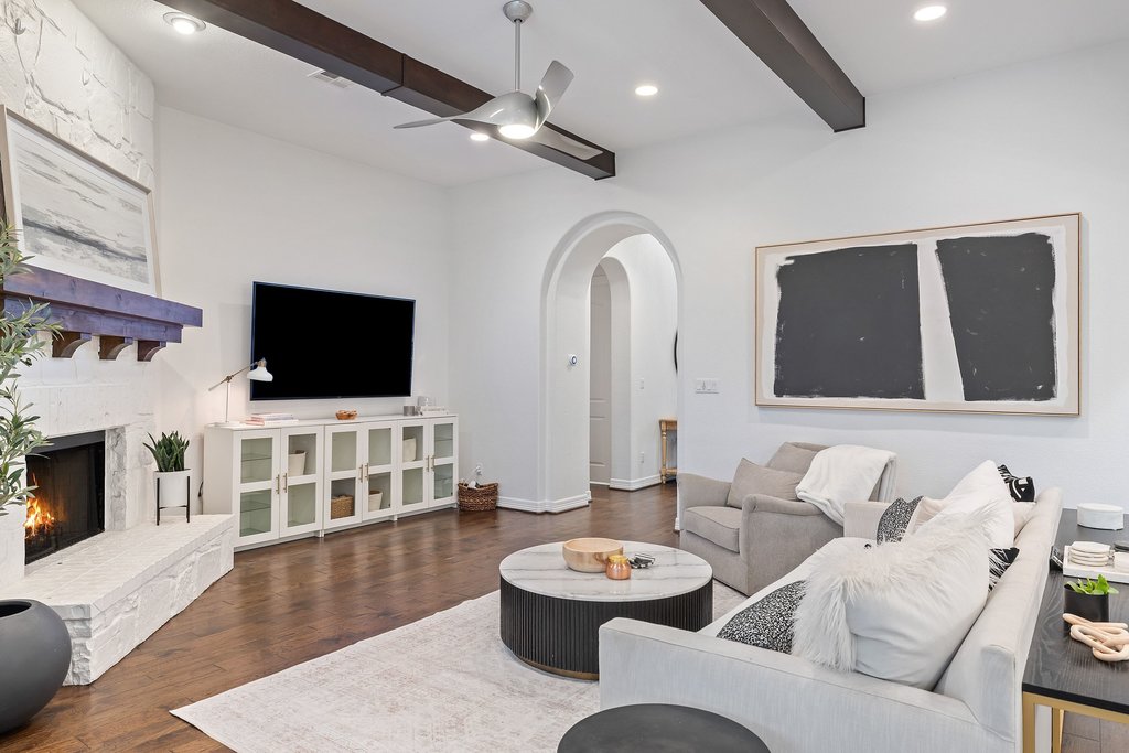 8801 Wild Rice Cove Austin, TX 78738 - Photo 8 of 40 Hardwood floors run through the main living areas, paired with recessed lighting, modern fixtures, and plantation shutters.