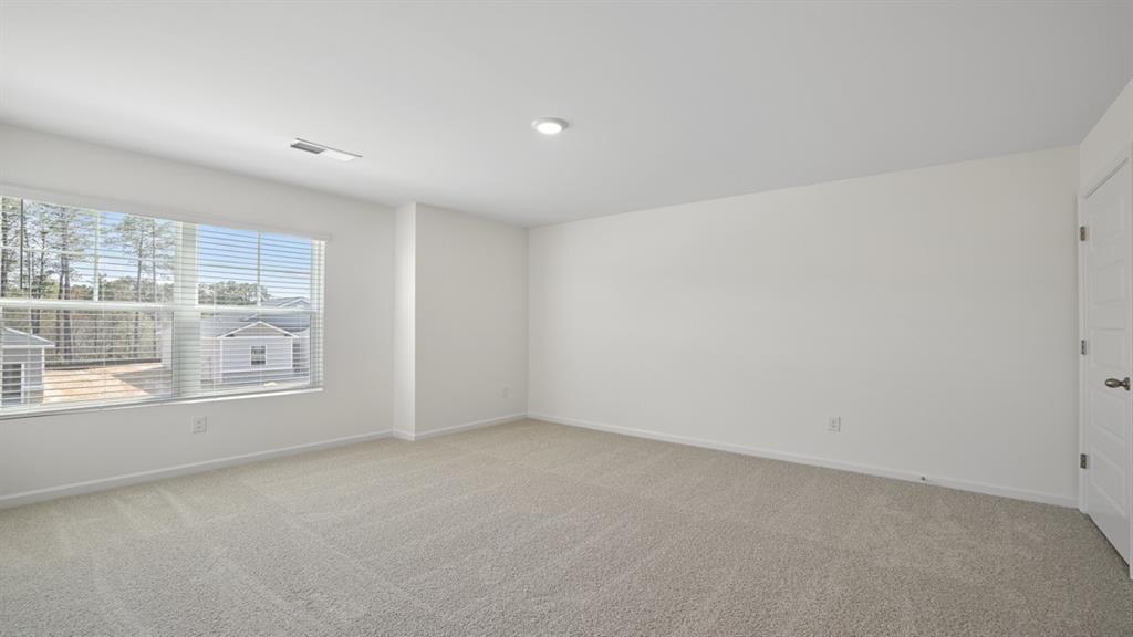 8580 Seabiscuit Road Lithonia, GA 30058 - Photo 25 of 37 an empty room with a window