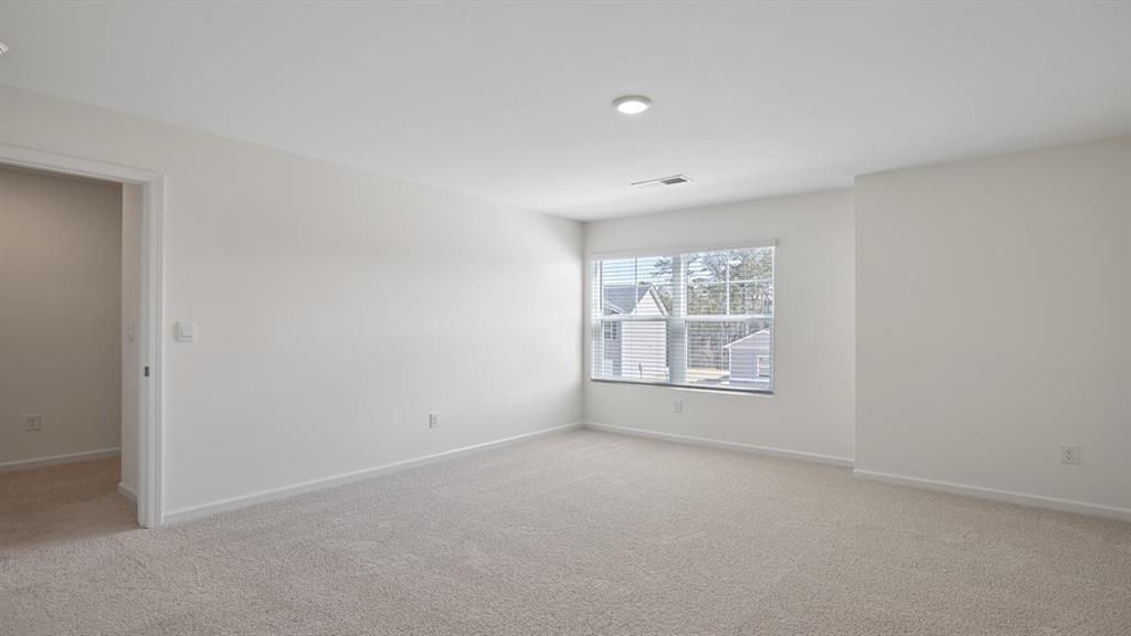 8580 Seabiscuit Road Lithonia, GA 30058 - Photo 26 of 37 an empty room with windows