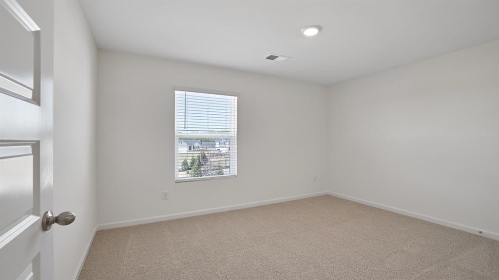8580 Seabiscuit Road Lithonia, GA 30058 - Photo 28 of 37 an empty room with a window
