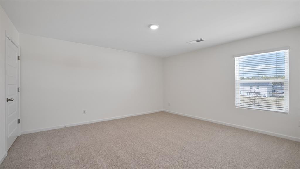 8580 Seabiscuit Road Lithonia, GA 30058 - Photo 30 of 37 a view of an empty room with a window
