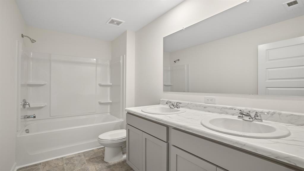 8580 Seabiscuit Road Lithonia, GA 30058 - Photo 33 of 37 a bathroom with a sink a toilet and shower