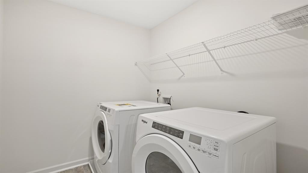 8580 Seabiscuit Road Lithonia, GA 30058 - Photo 34 of 37 a utility room with dryer and washer