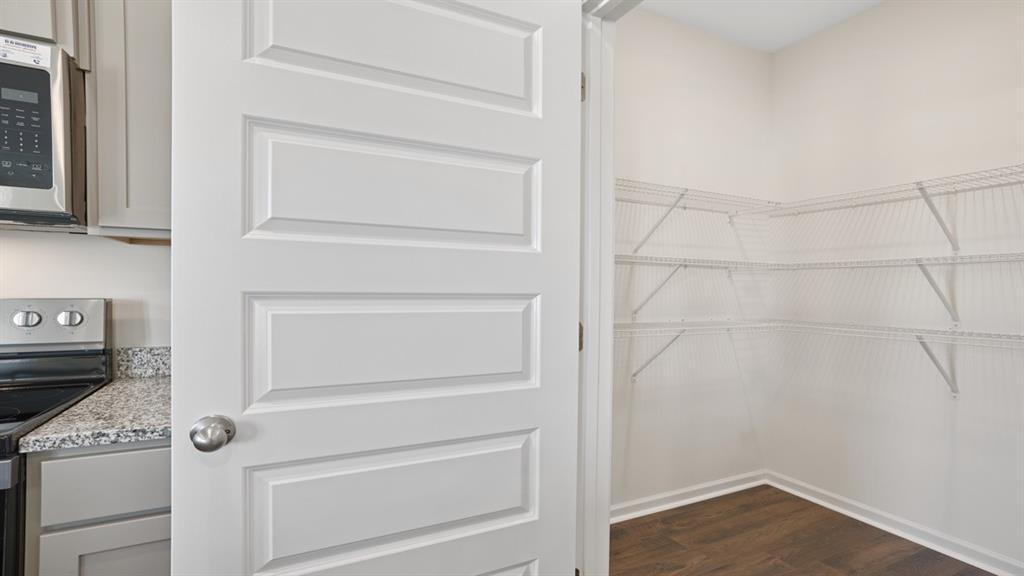 8580 Seabiscuit Road Lithonia, GA 30058 - Photo 7 of 37 a view of walk in closet with empty racks