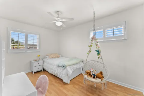 a room with furniture and a potted plant