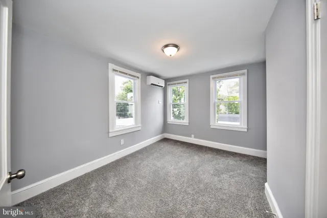 an empty room with windows