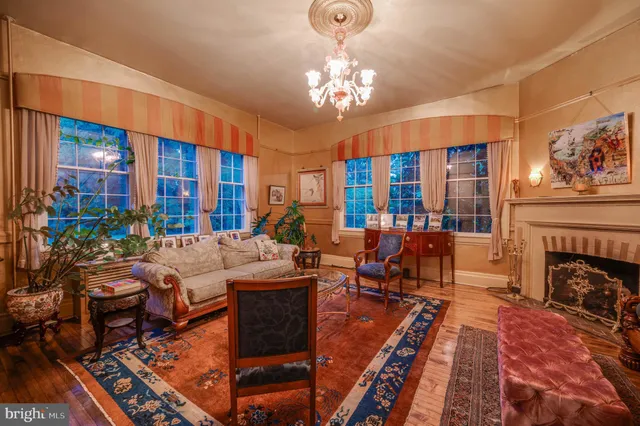 a view of a dining room with furniture wooden floor and chandelier