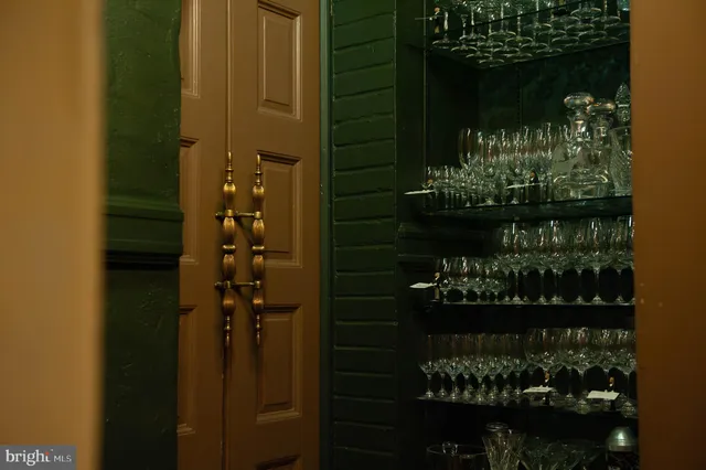 a view of an entryway with wooden floor and door