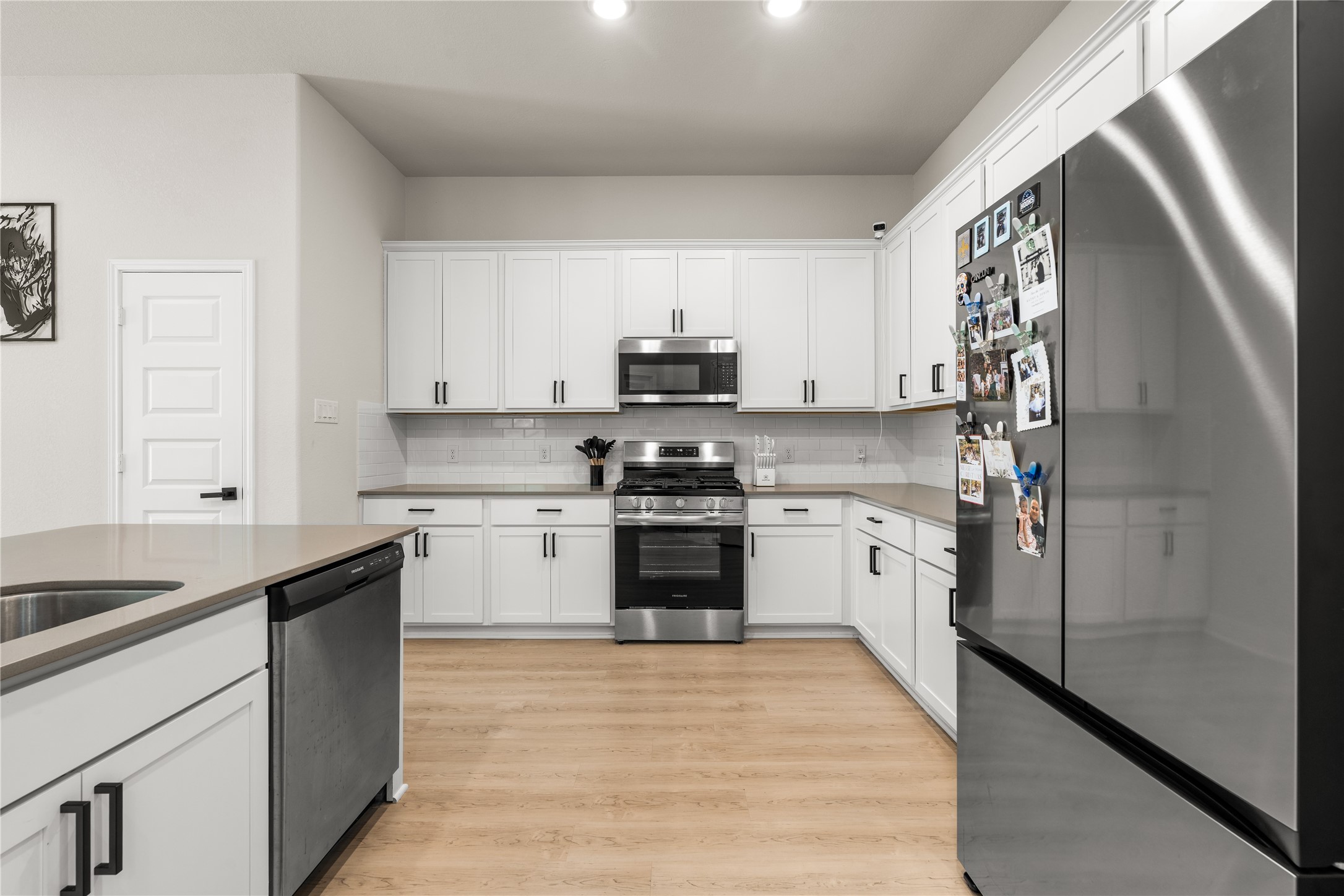 4001 Baja Lane Houston, TX 77045 - Photo 5 of 27 Thoughtfully designed with everyday living in mind, the kitchen offers generous circulation space that allows multiple people to cook, gather, and move comfortably without interrupting the flow of the room.