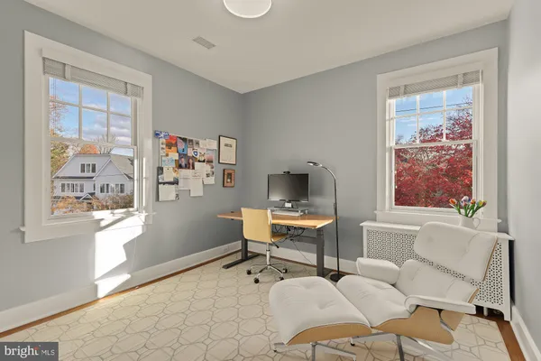 a workspace with furniture and window