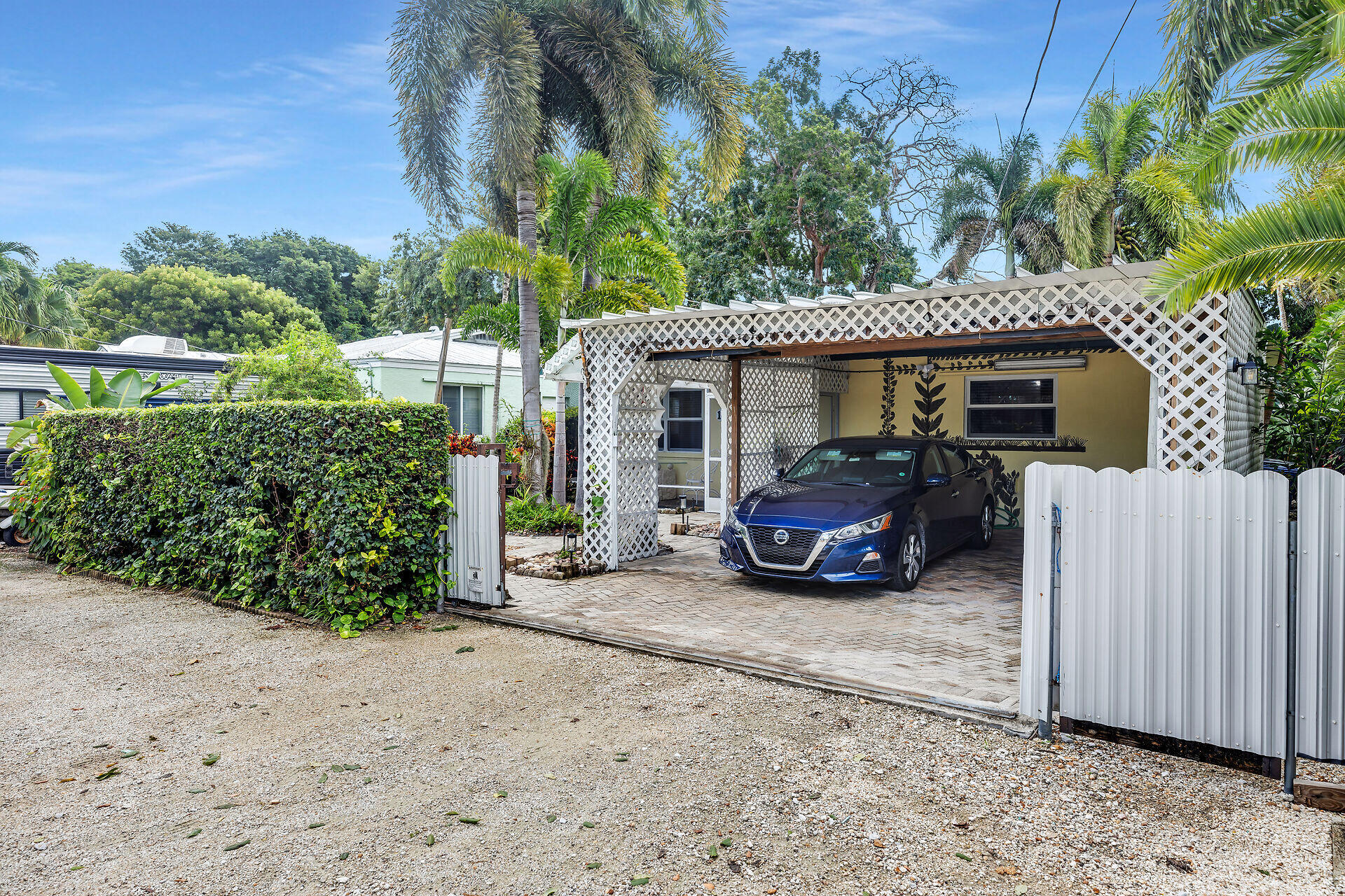 13 Bass Avenue Key Largo, FL 33037 - Photo 2 of 43 a car parked in front of house