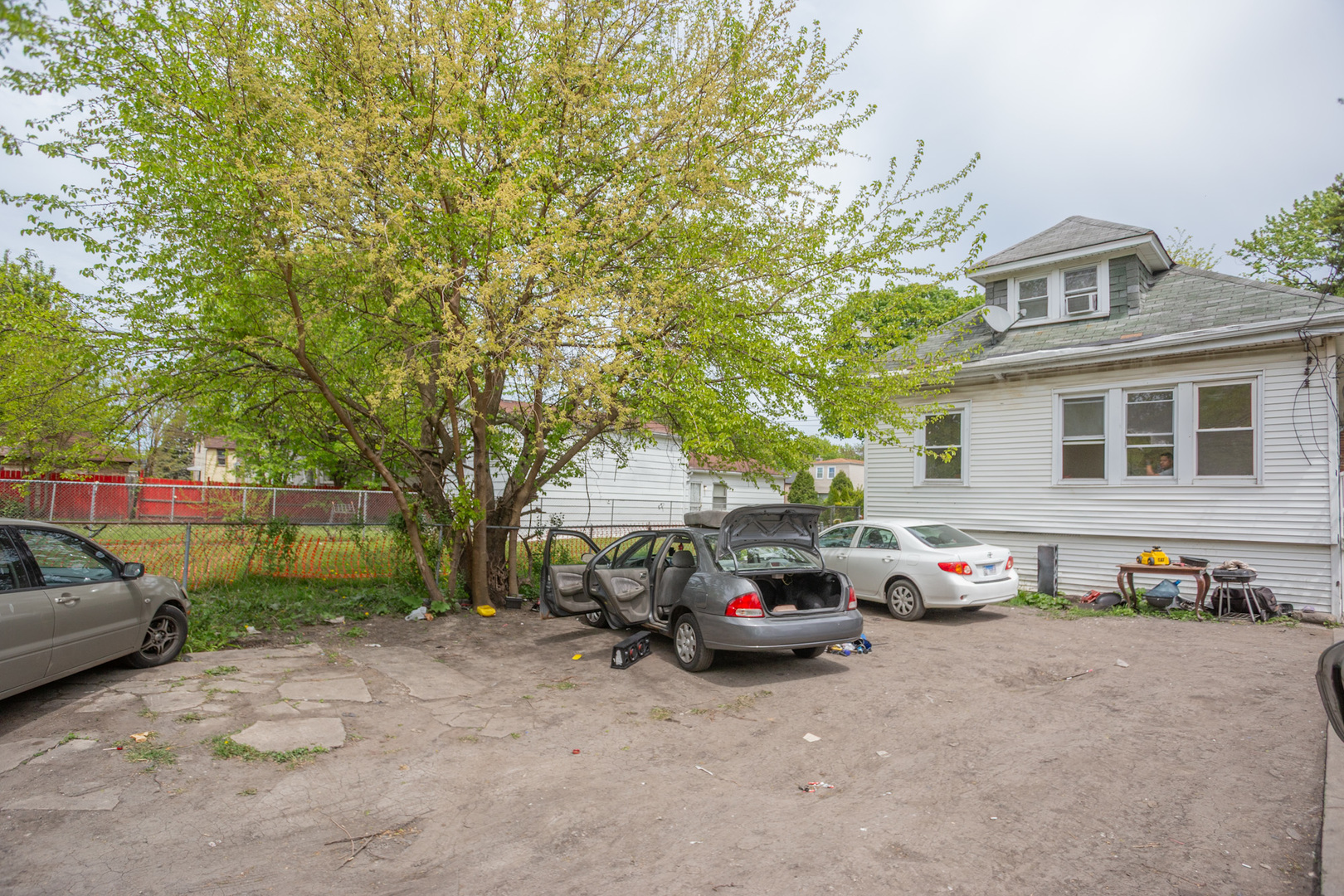 9226 South Ellis Avenue Chicago, IL 60619 - Photo 17 of 17 a car parked in front of a house
