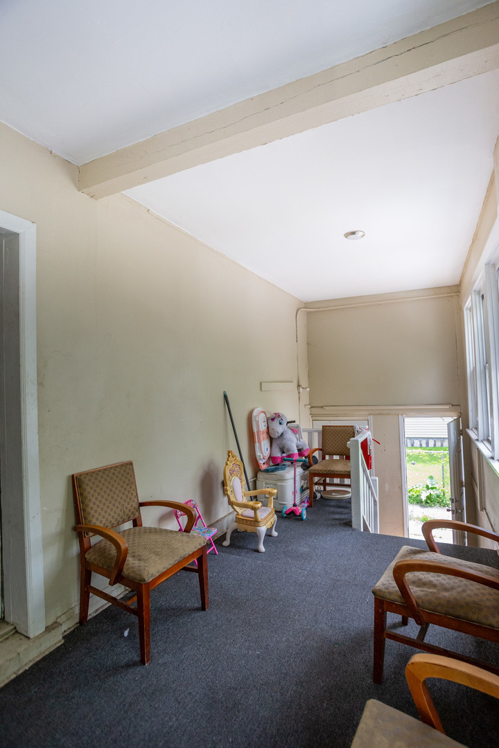 9226 South Ellis Avenue Chicago, IL 60619 - Photo 8 of 17 a living room with furniture a air conditioner vent and a window