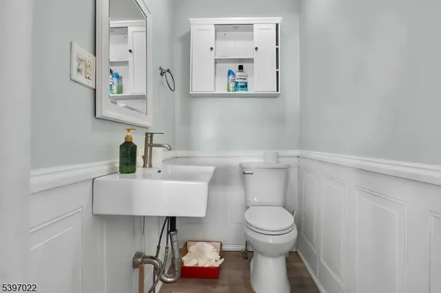 a bathroom with a toilet a sink and bathtub