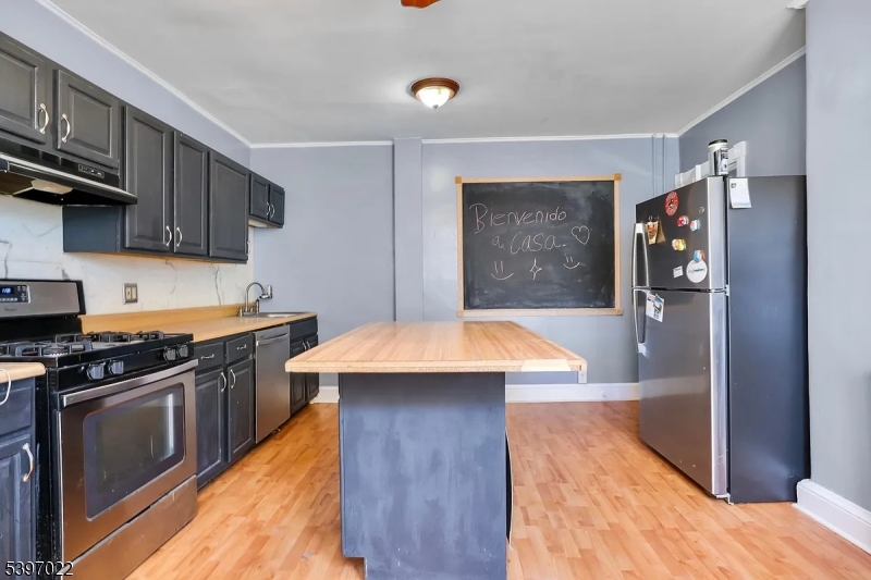 929 Bordentown Road Burlington, NJ 08016 - Photo 5 of 12 a kitchen with stainless steel appliances kitchen island a refrigerator sink and stove
