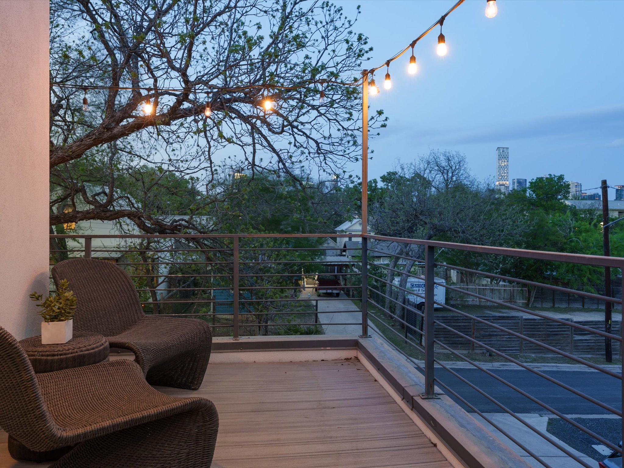 615 Jewell Street Austin, TX 78704 - Photo 22 of 25 Outdoor living shines with this upper level balcony where you can take in views of the city skyline.