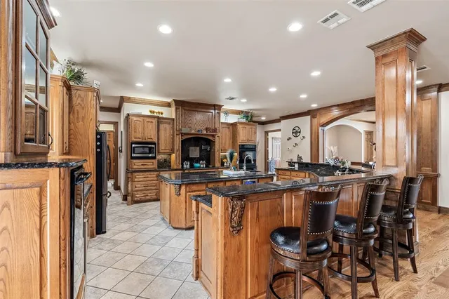 a view of a living room and kitchen with furniture
