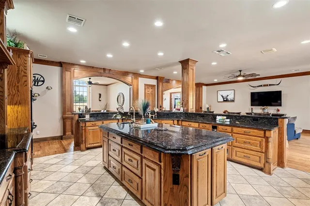 a kitchen with lots of counter top space and stainless steel appliances