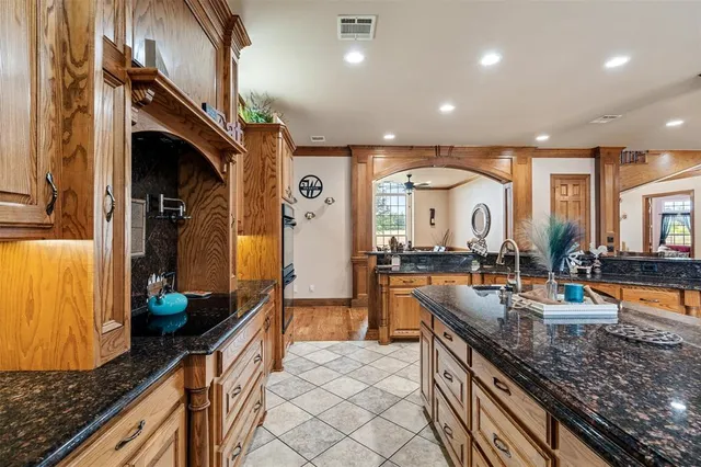 a kitchen with granite countertop lots of counter top space