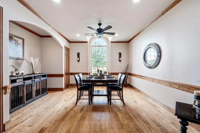 a large kitchen with granite countertop a large counter top and stainless steel appliances