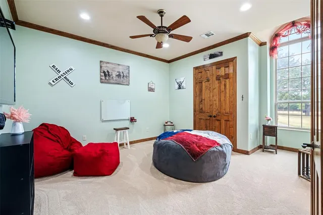 a dining room with chandelier and wooden floor