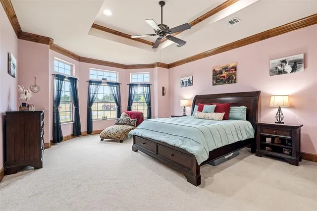 a bedroom with a bed couch and dresser