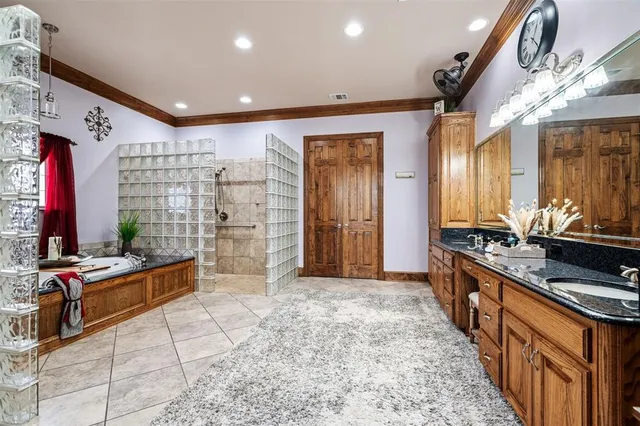 a bedroom with a bed dresser and furniture