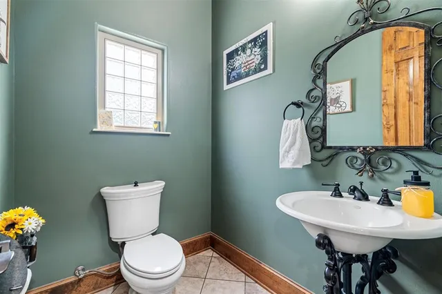 a bathroom with a sink a vanity and a mirror