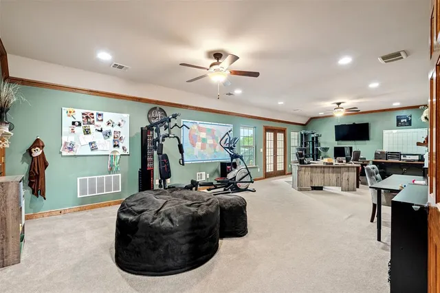 a view of a hallway with wooden floor and stairs