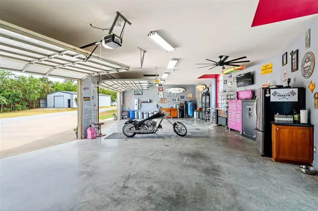 a bathroom with a sink a vanity and a large mirror
