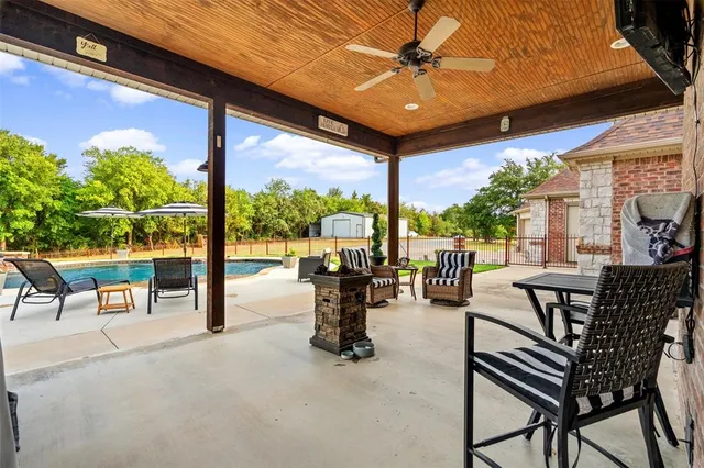 a view of a swimming pool with a patio