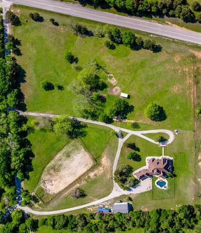 a view of a swimming pool with a garden
