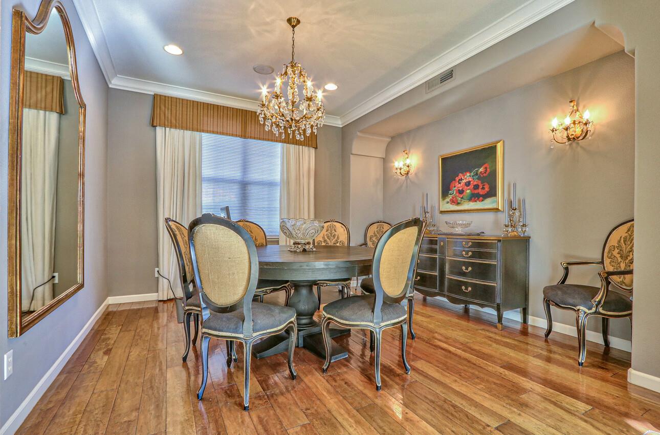 7260 Eagle Ridge Drive Gilroy, CA 95020 - Photo 16 of 36 a view of a dining room with furniture wooden floor and chandelier