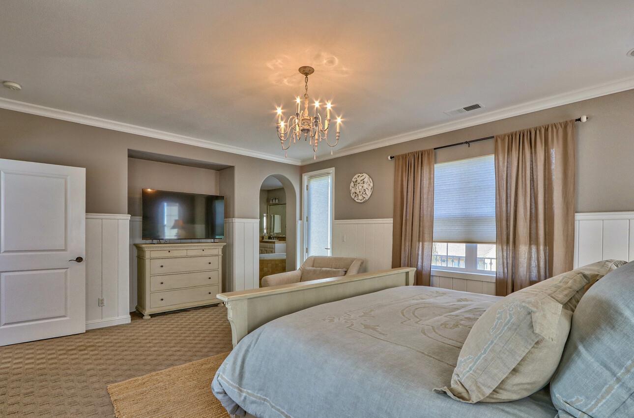 7260 Eagle Ridge Drive Gilroy, CA 95020 - Photo 22 of 36 a bedroom with a large bed and a window