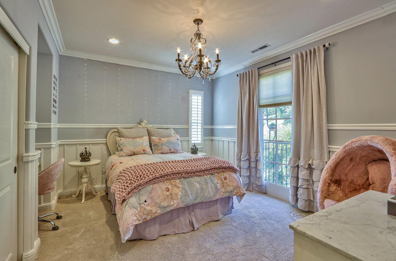 7260 Eagle Ridge Drive Gilroy, CA 95020 - Photo 25 of 36 a spacious bedroom with a bed and a chandelier