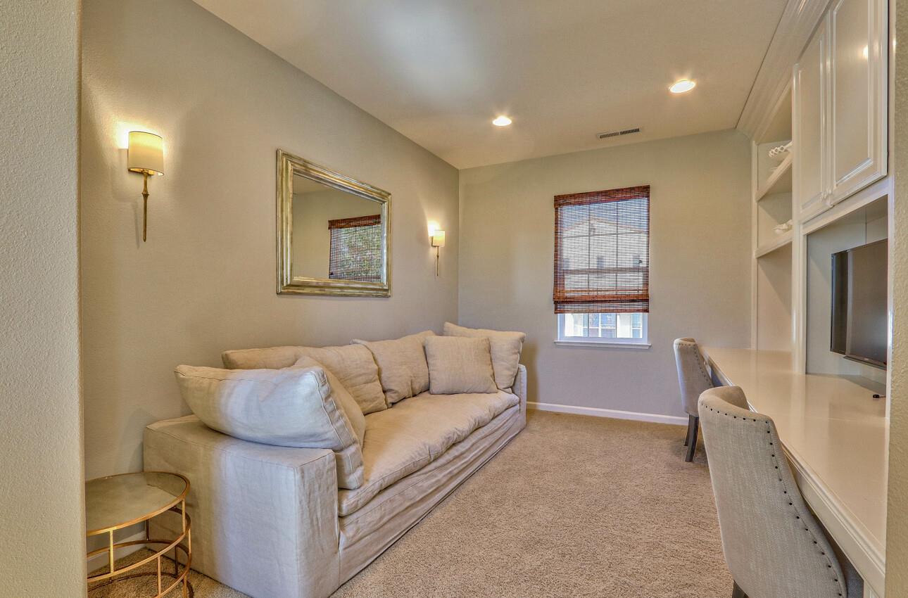 7260 Eagle Ridge Drive Gilroy, CA 95020 - Photo 28 of 36 a living room with furniture and a flat screen tv