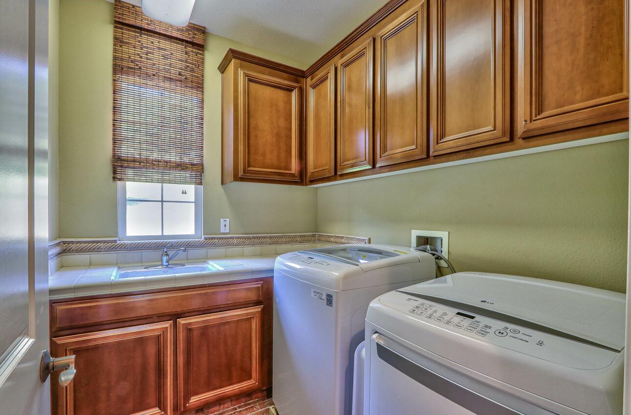 7260 Eagle Ridge Drive Gilroy, CA 95020 - Photo 29 of 36 a utility room with a sink washer and dryer