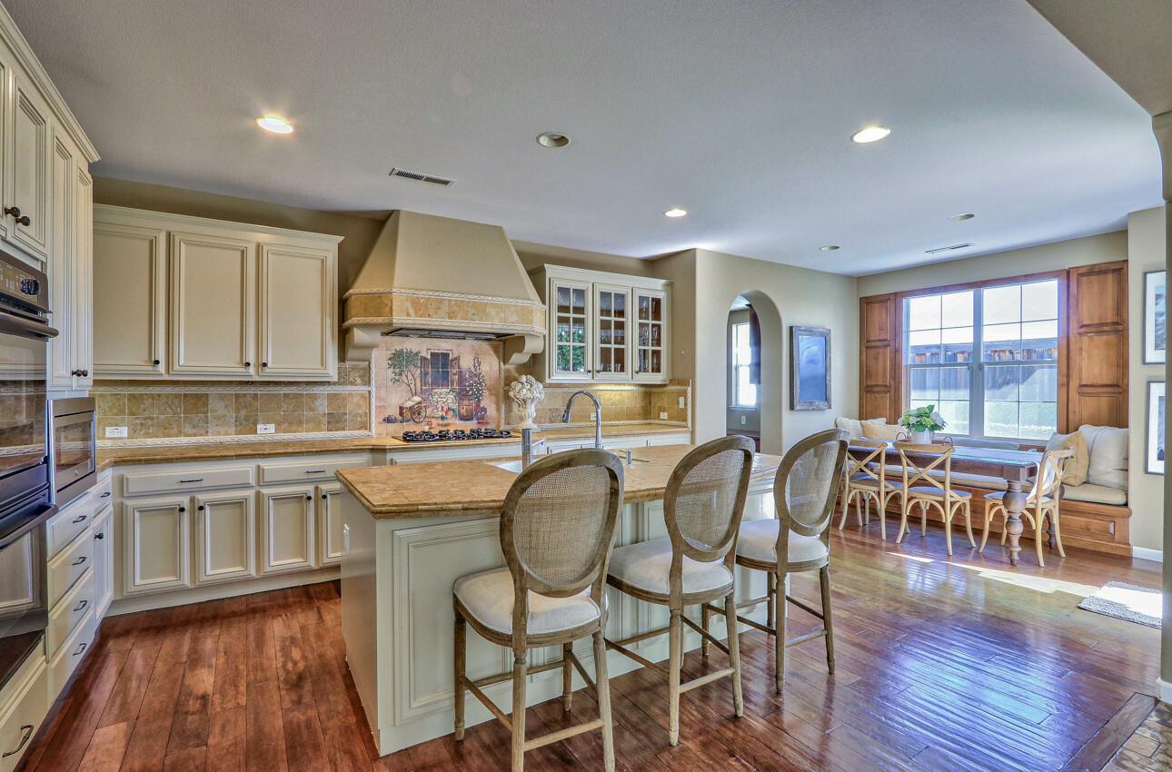7260 Eagle Ridge Drive Gilroy, CA 95020 - Photo 9 of 36 a kitchen with sink cabinets and dining table chair