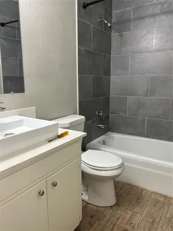 a bathroom with a sink toilet and bathtub