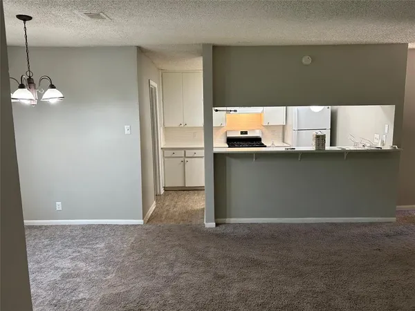 a view of a kitchen with a sink