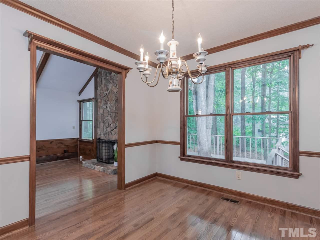 8701 Brandon Station Road Raleigh, NC 27613 - Photo 6 of 30 Elegant dining room overlooking the scenic backyard.