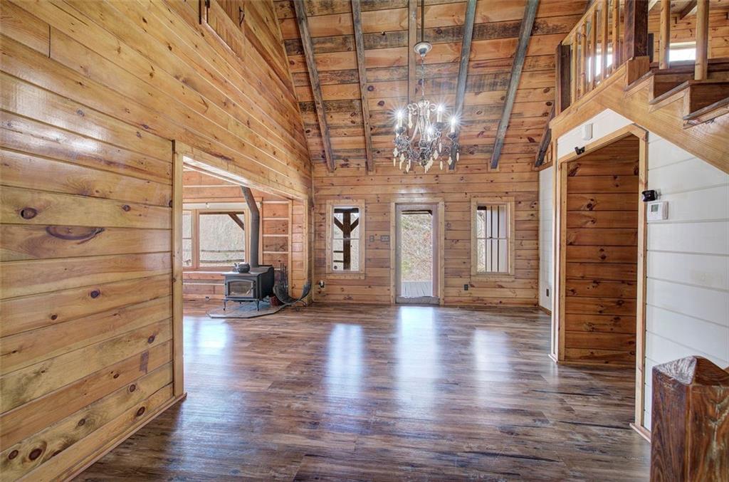 1252 Paris Mountain Road Rockmart, GA 30153 - Photo 21 of 93 a view of a hallway with wooden floor and a chandelier