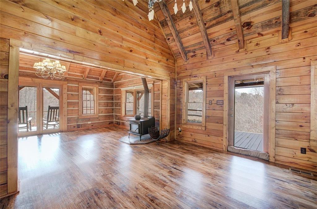 1252 Paris Mountain Road Rockmart, GA 30153 - Photo 22 of 93 an empty room with wooden floor and windows